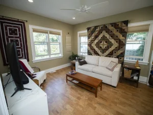 Thieme Addition: Family room in the new addition with wood floors and windows on two sides